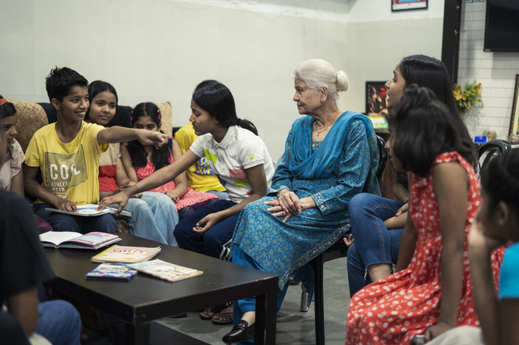 Mentor Mother engaging with Udayan Ghar children during a group activity.